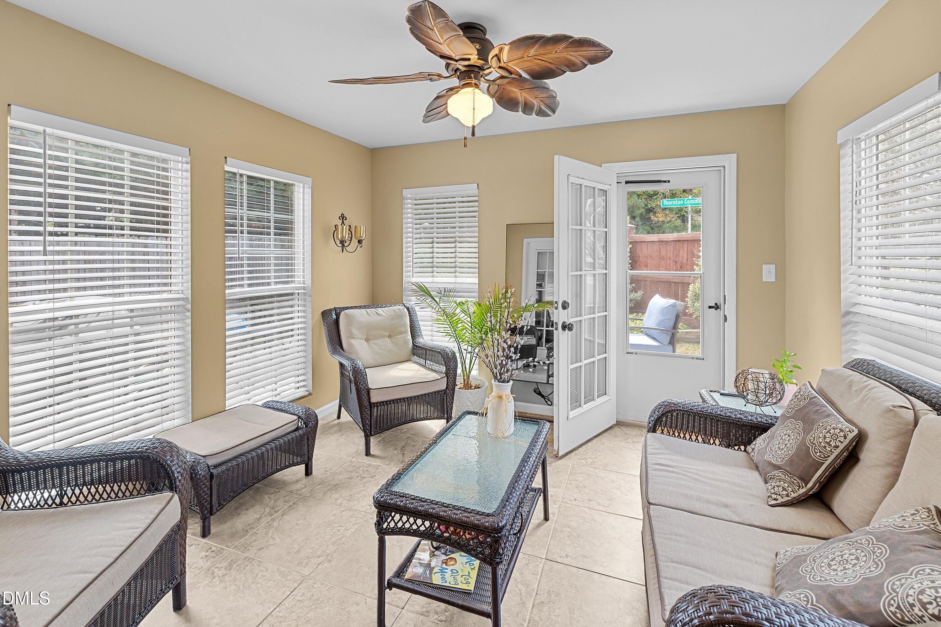 8911 Elizabeth Bennet Place Raleigh, NC 27616 - Photo 8 of 25 a living room with furniture and a large window
