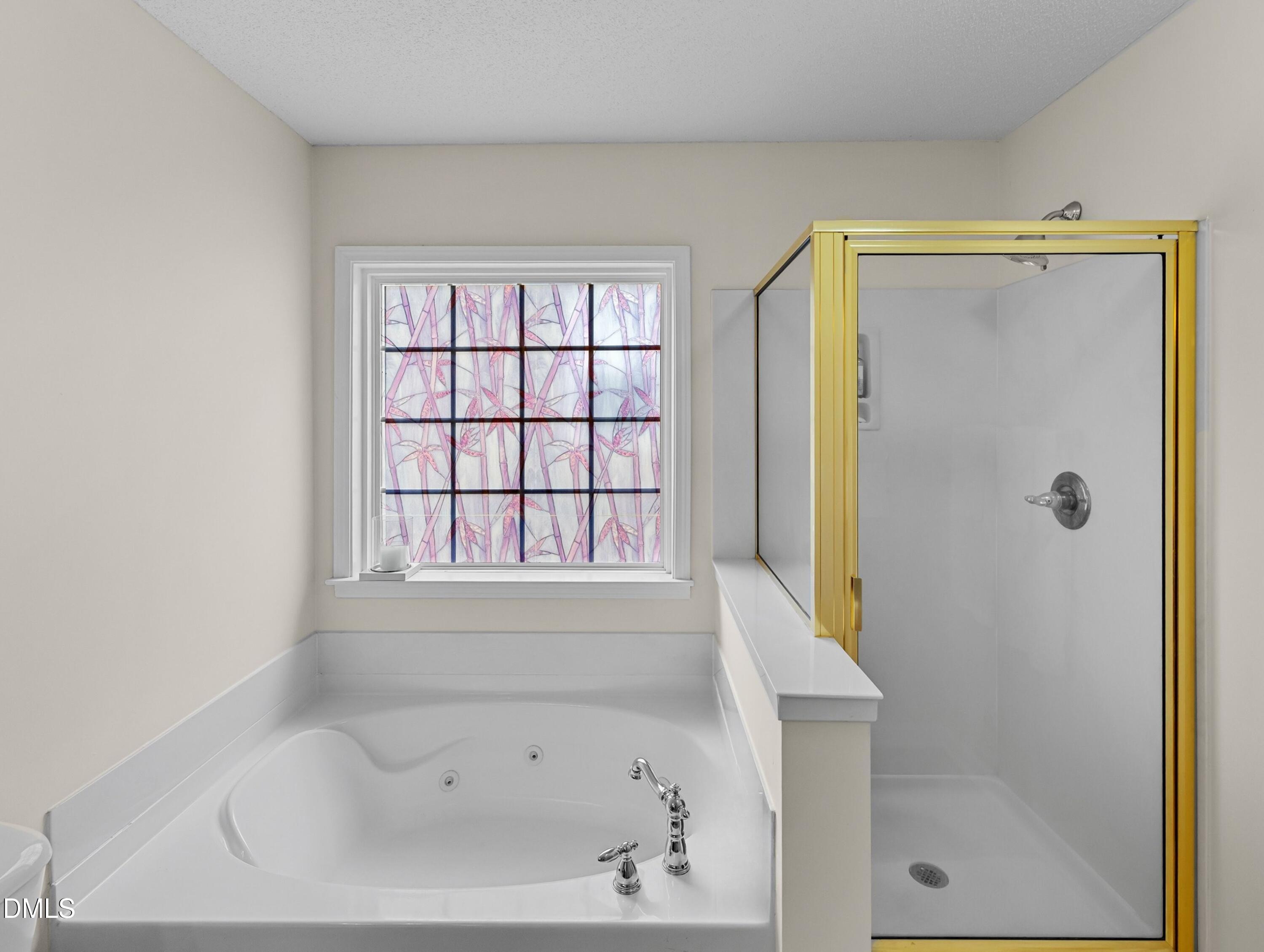 8911 Elizabeth Benneth Place Raleigh, NC 27616 - Photo 16 of 31 a bathroom with a bathtub