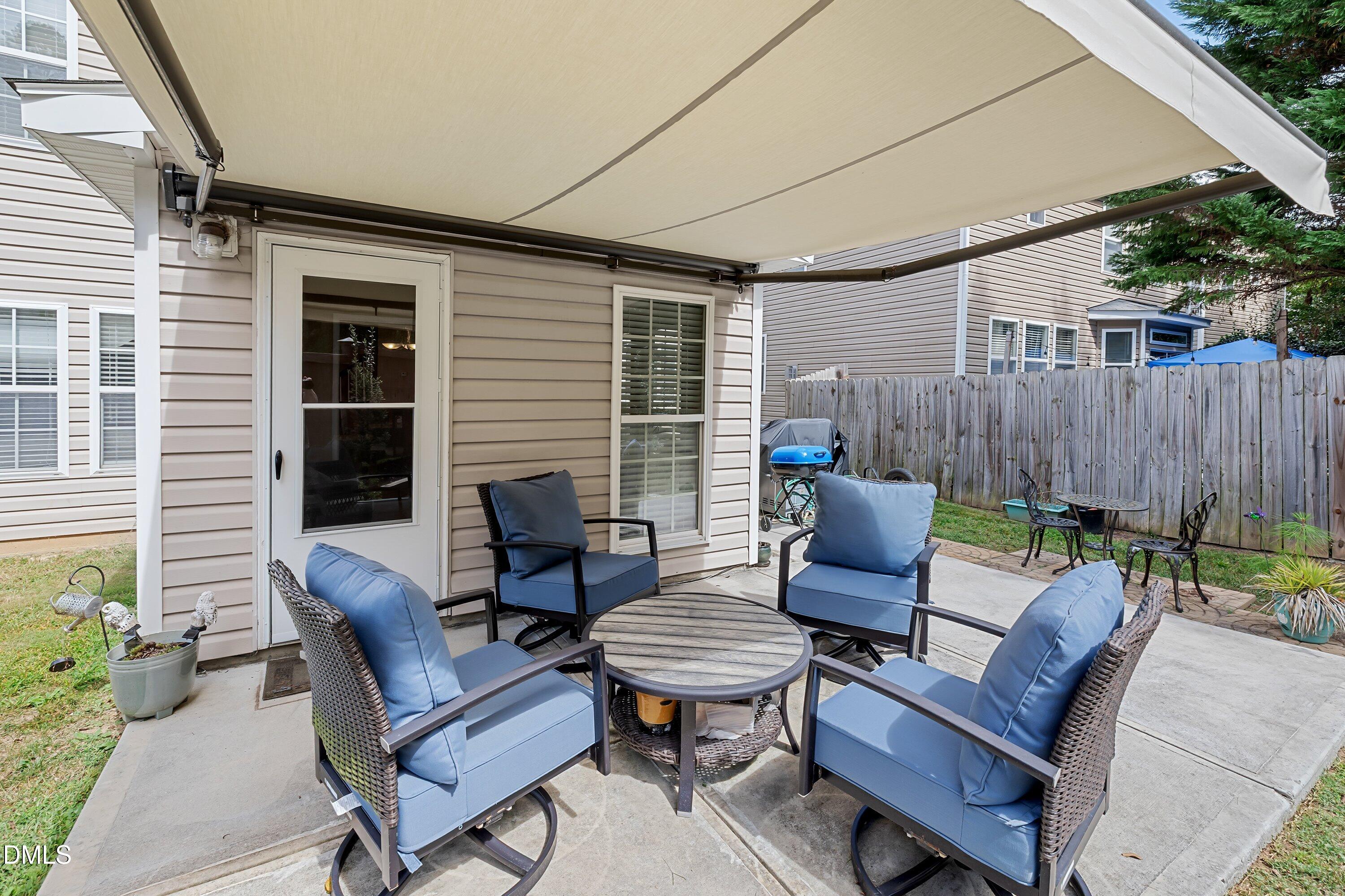 8911 Elizabeth Benneth Place Raleigh, NC 27616 - Photo 22 of 31 a building outdoor space with patio furniture