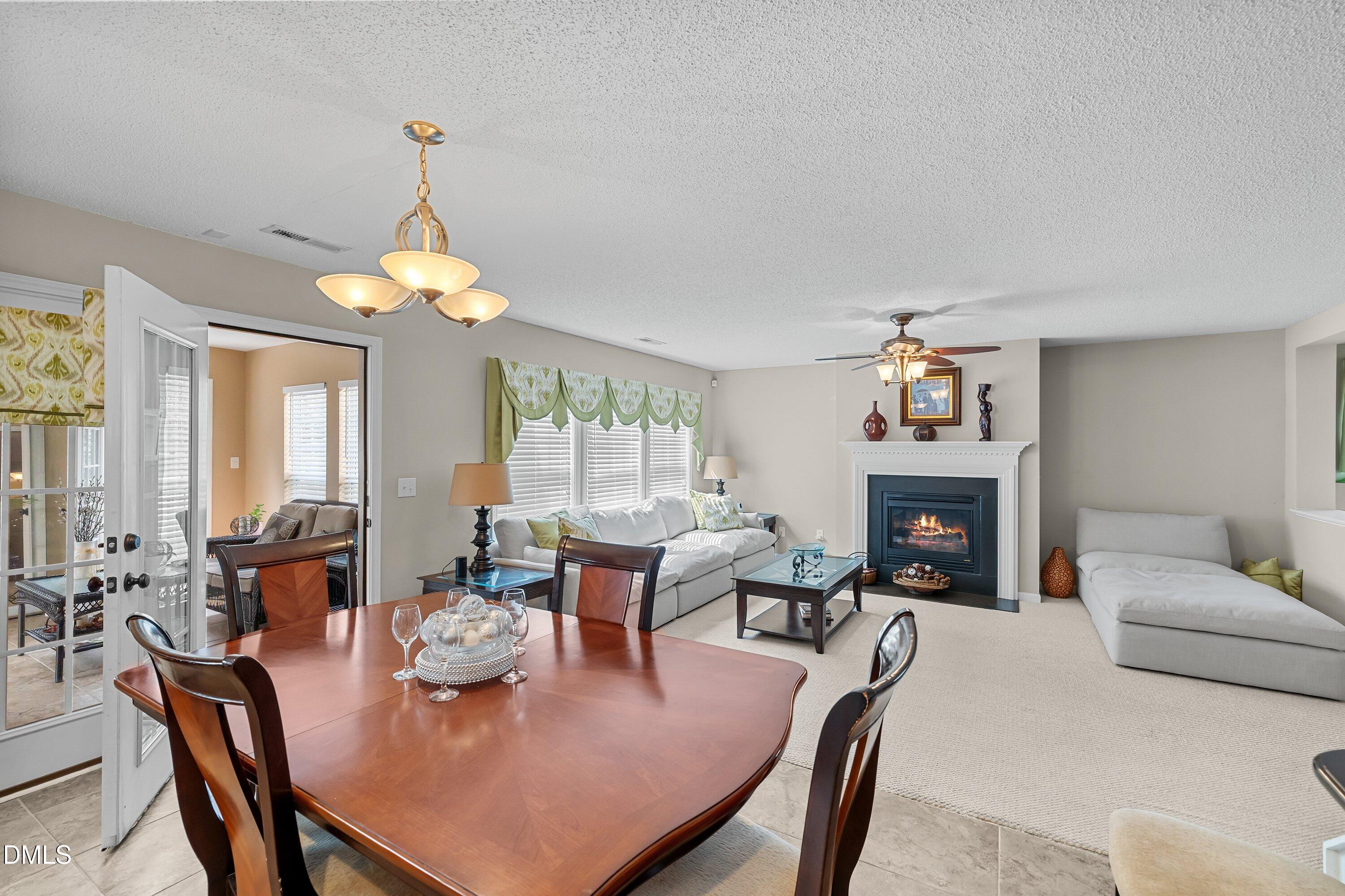 8911 Elizabeth Bennet Place Raleigh, NC 27616 - Photo 6 of 25 a view of a dining room with furniture window and outside view
