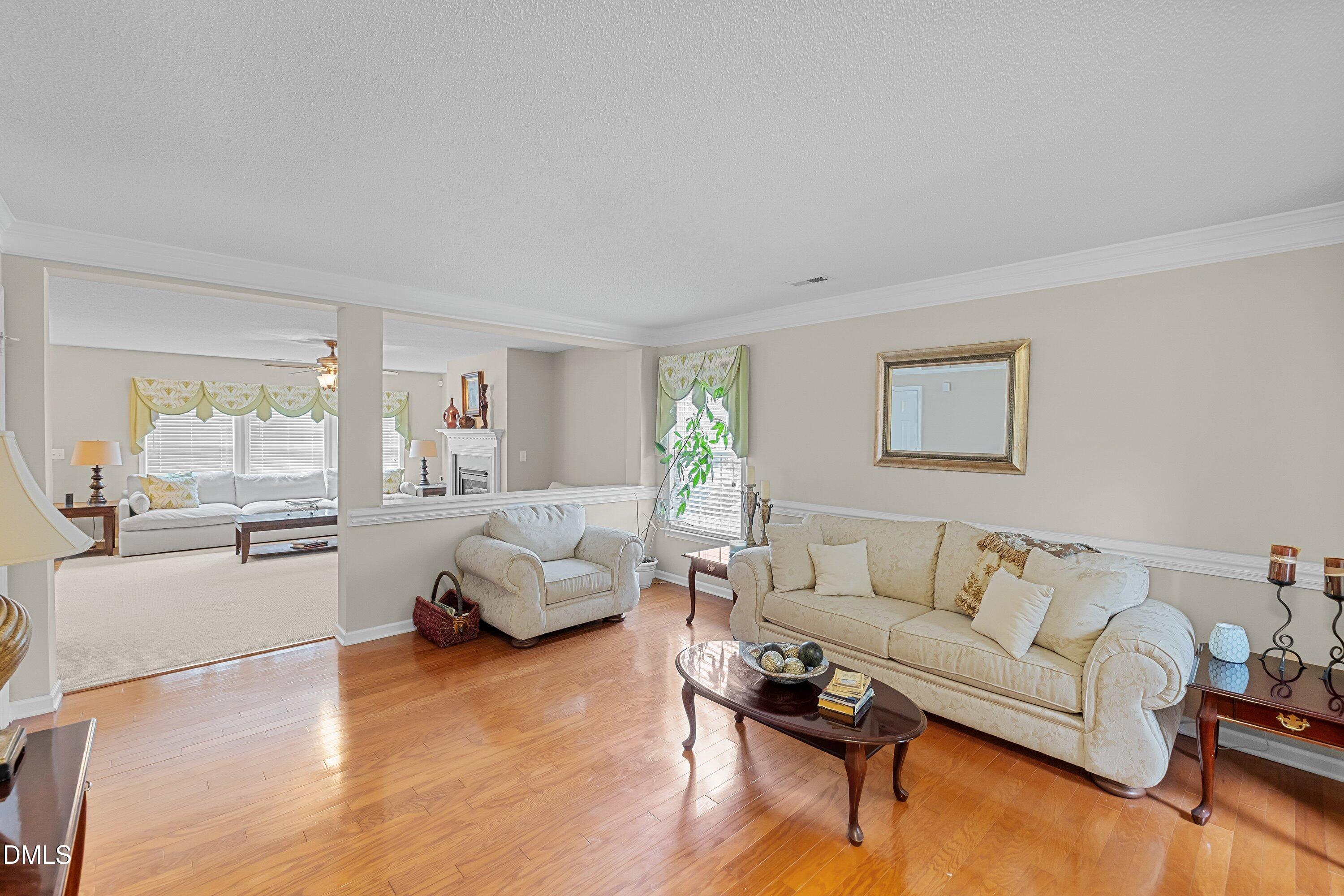 8911 Elizabeth Benneth Place Raleigh, NC 27616 - Photo 7 of 31 a living room with furniture and a large window