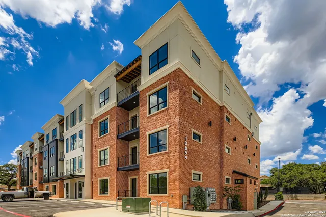 a view of a building with a street