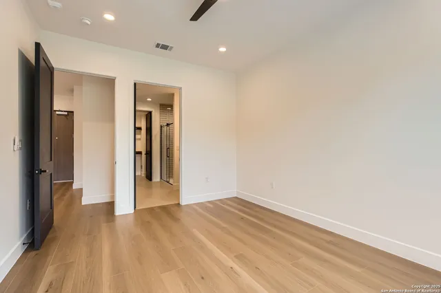 a view of hallway with wooden floor