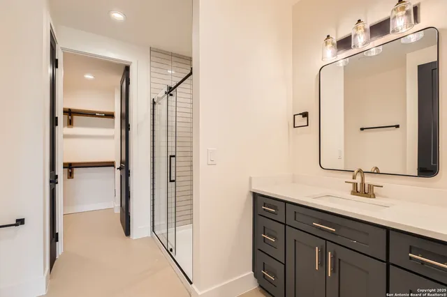 a bathroom with a double vanity sink mirror and double