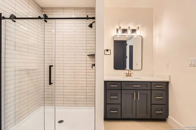 a bathroom with a sink and a mirror