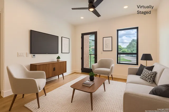 a living room with furniture and a flat screen tv