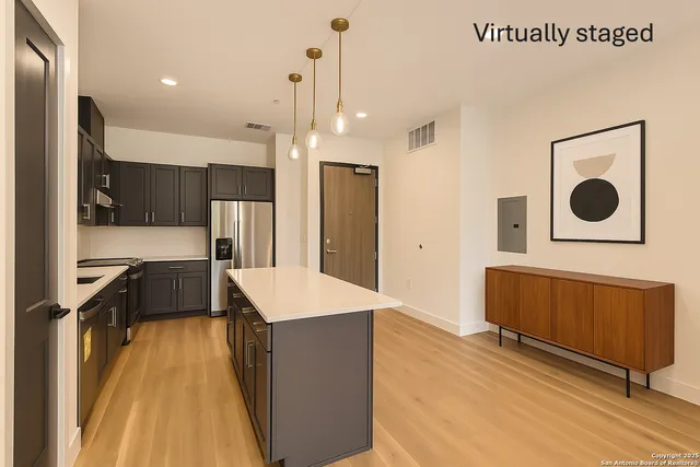 a kitchen with a refrigerator and a sink