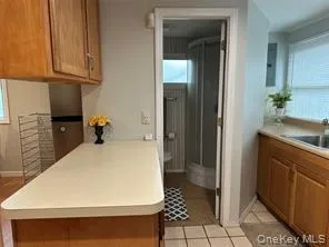 a view of kitchen with furniture and wooden floor