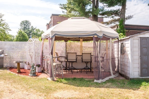 789 Boston Road Billerica, MA 01821 - Photo 22 of 23 a view of a patio with a table chairs and a yard