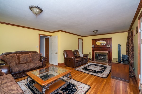 789 Boston Road Billerica, MA 01821 - Photo 5 of 23 a living room with furniture and a fireplace