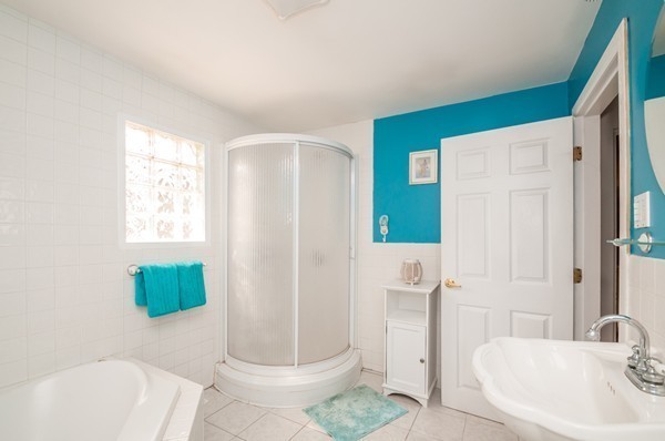 789 Boston Road Billerica, MA 01821 - Photo 8 of 23 a bathroom with a sink a toilet and shower