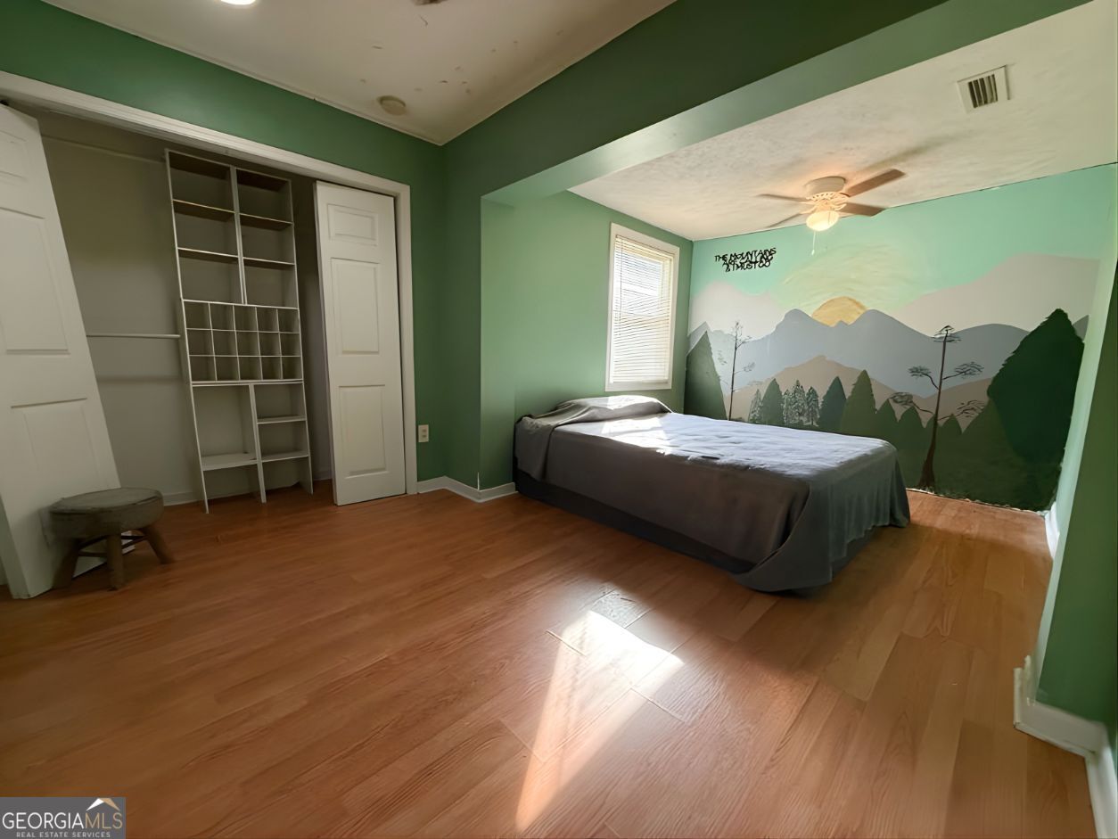 19963 Highway 46 Pembroke, GA 31321 - Photo 14 of 17 a bedroom with a bed and a window