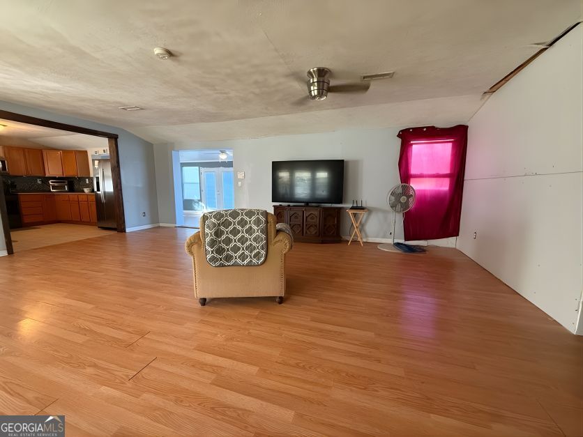 19963 Highway 46 Pembroke, GA 31321 - Photo 3 of 17 a view of living room with furniture and flat screen tv