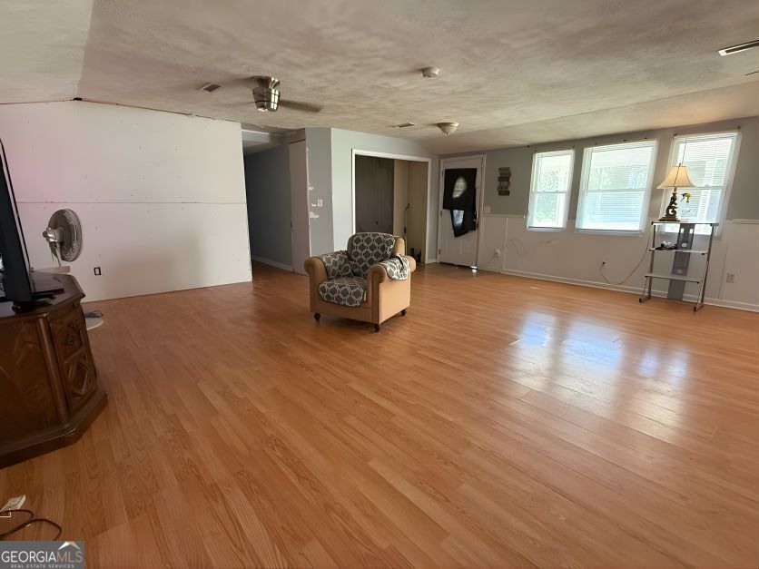19963 Highway 46 Pembroke, GA 31321 - Photo 4 of 17 a living room with furniture and a wooden floor