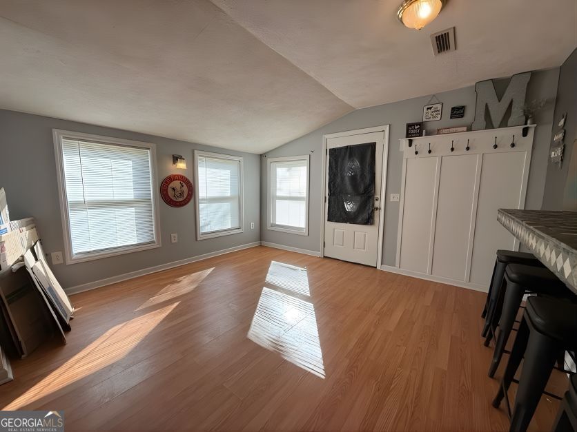 19963 Highway 46 Pembroke, GA 31321 - Photo 8 of 17 a view of a livingroom with a fireplace and window
