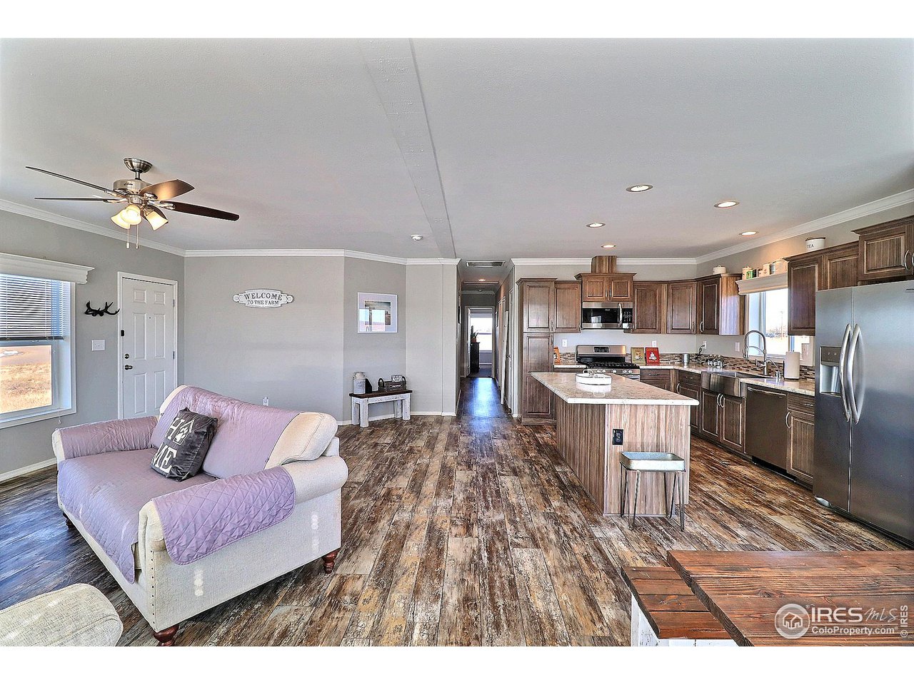 37 East Ranch Road Wiggins, CO 80654 - Photo 9 of 34 Gorgeous LVP Flooring