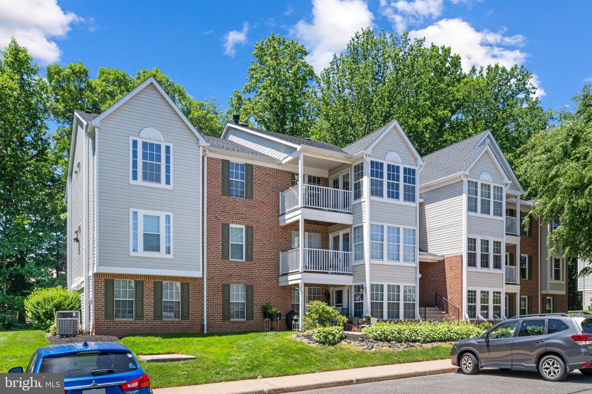 3105 Cardinal Way, Unit L Abingdon, MD 21009 - Photo 1 of 31 a front view of a residential apartment building with a yard