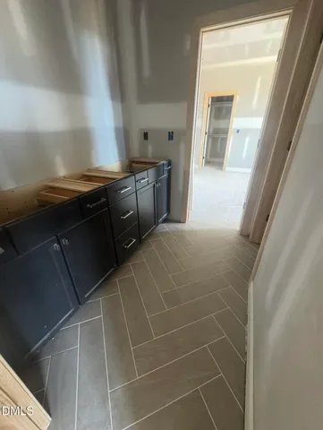 a bathroom with a granite countertop sink a vanity and a mirror