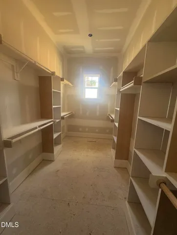 a view of an empty room with windows