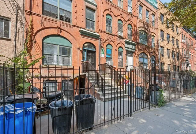 a view of a brick building with many windows