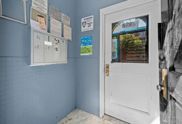 a bathroom with a window and a shower