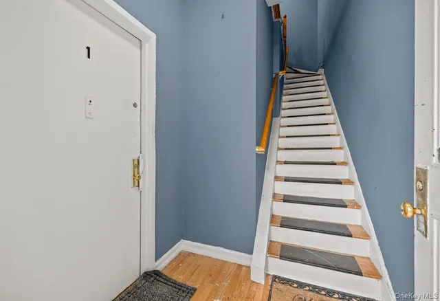 a view of entryway with wooden floor