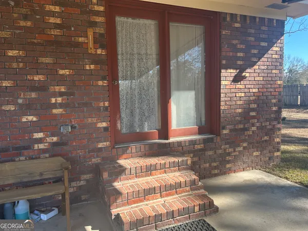 a bathroom with a bathtub and window