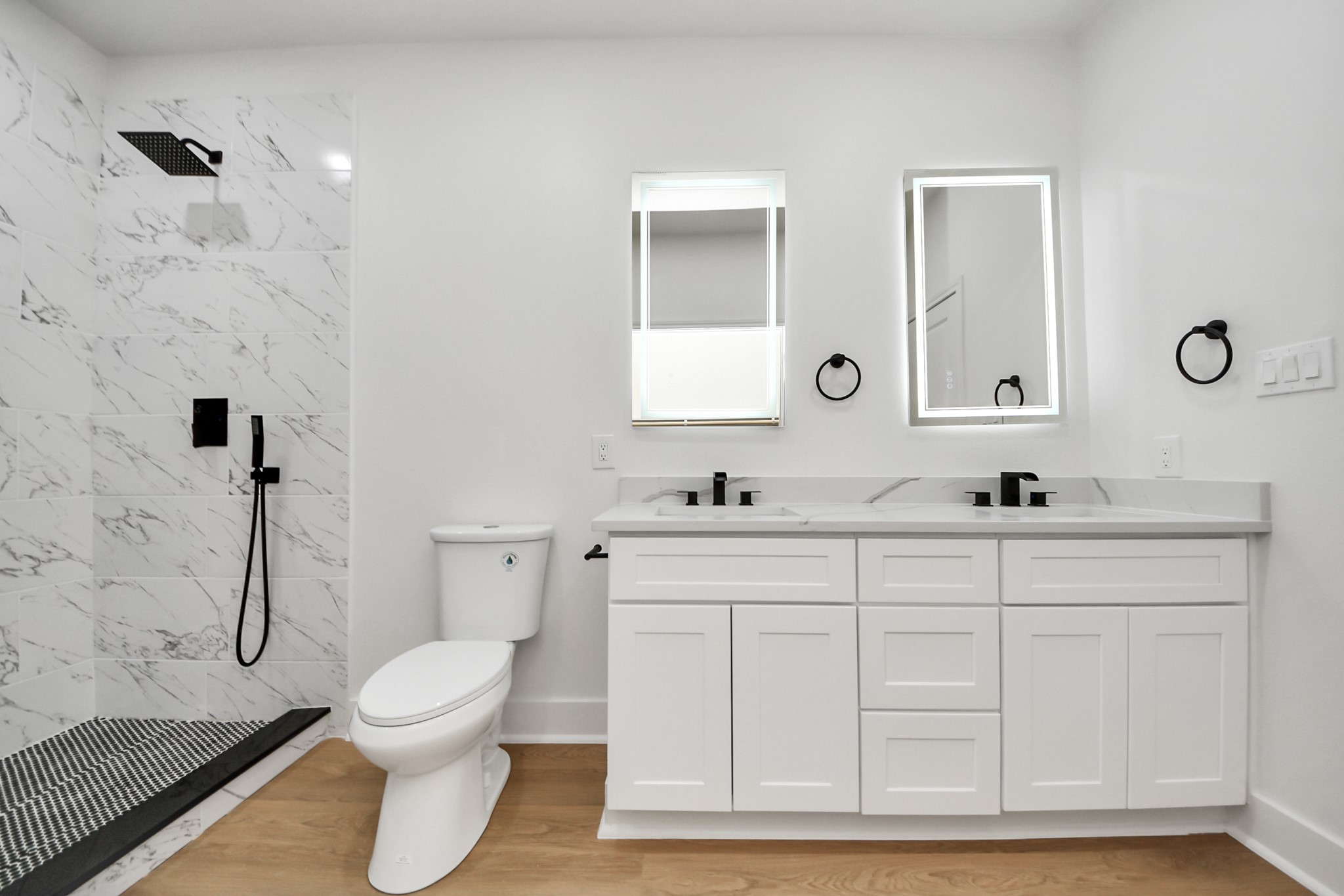 5226 Ricky Street Houston, TX 77033 - Photo 47 of 50 a bathroom with a toilet sink and mirror