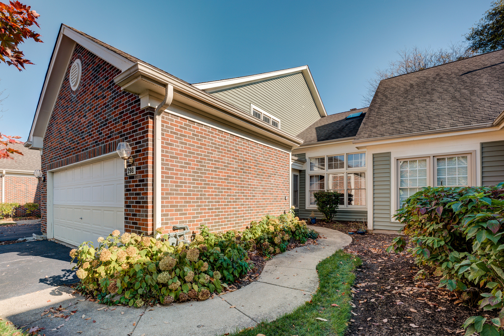 298 Ripplebrook Court Schaumburg, IL 60173 - Photo 2 of 27 a front view of a house with garden