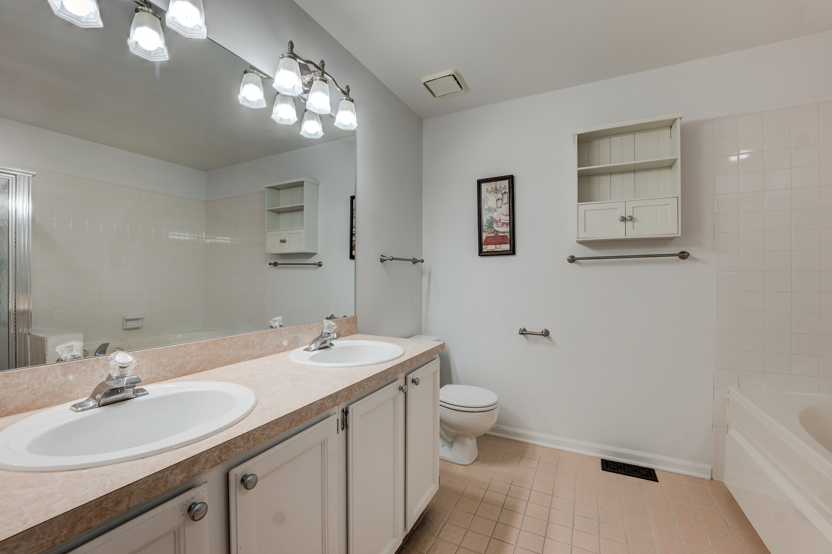 298 Ripplebrook Court Schaumburg, IL 60173 - Photo 17 of 27 a bathroom with a sink a toilet and a mirror