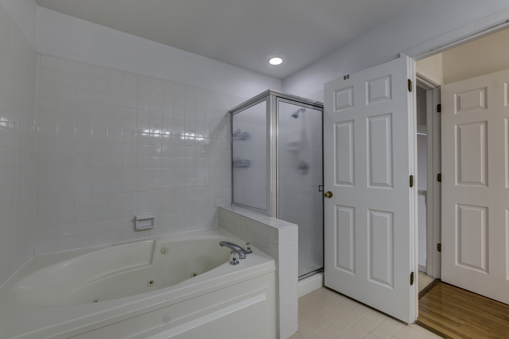 298 Ripplebrook Court Schaumburg, IL 60173 - Photo 18 of 27 a bathroom with a bathtub and a shower