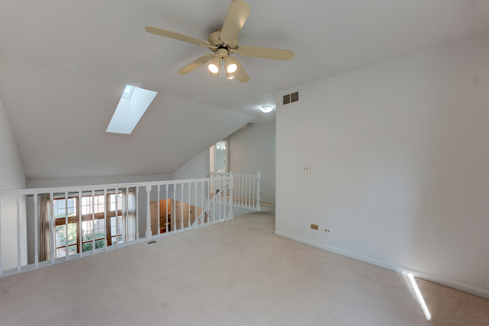 298 Ripplebrook Court Schaumburg, IL 60173 - Photo 22 of 27 wooden floor in an empty room with a window