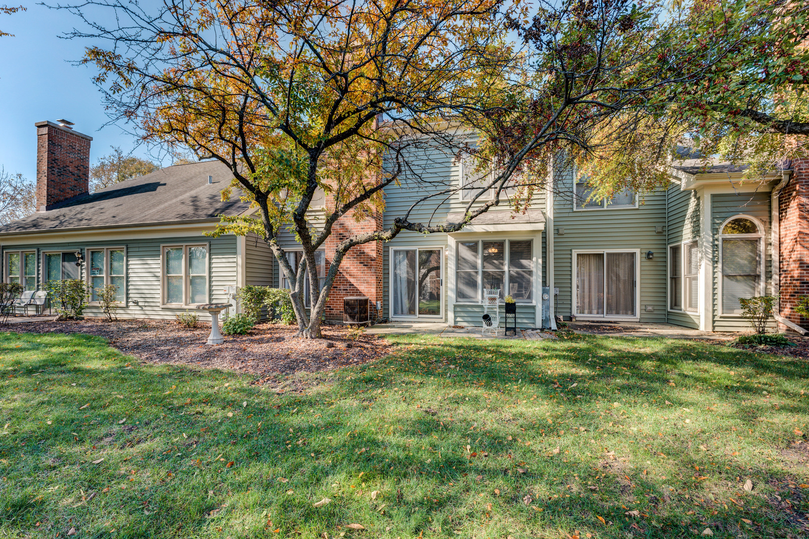 298 Ripplebrook Court Schaumburg, IL 60173 - Photo 26 of 27 front view of a brick house with a big yard and large trees