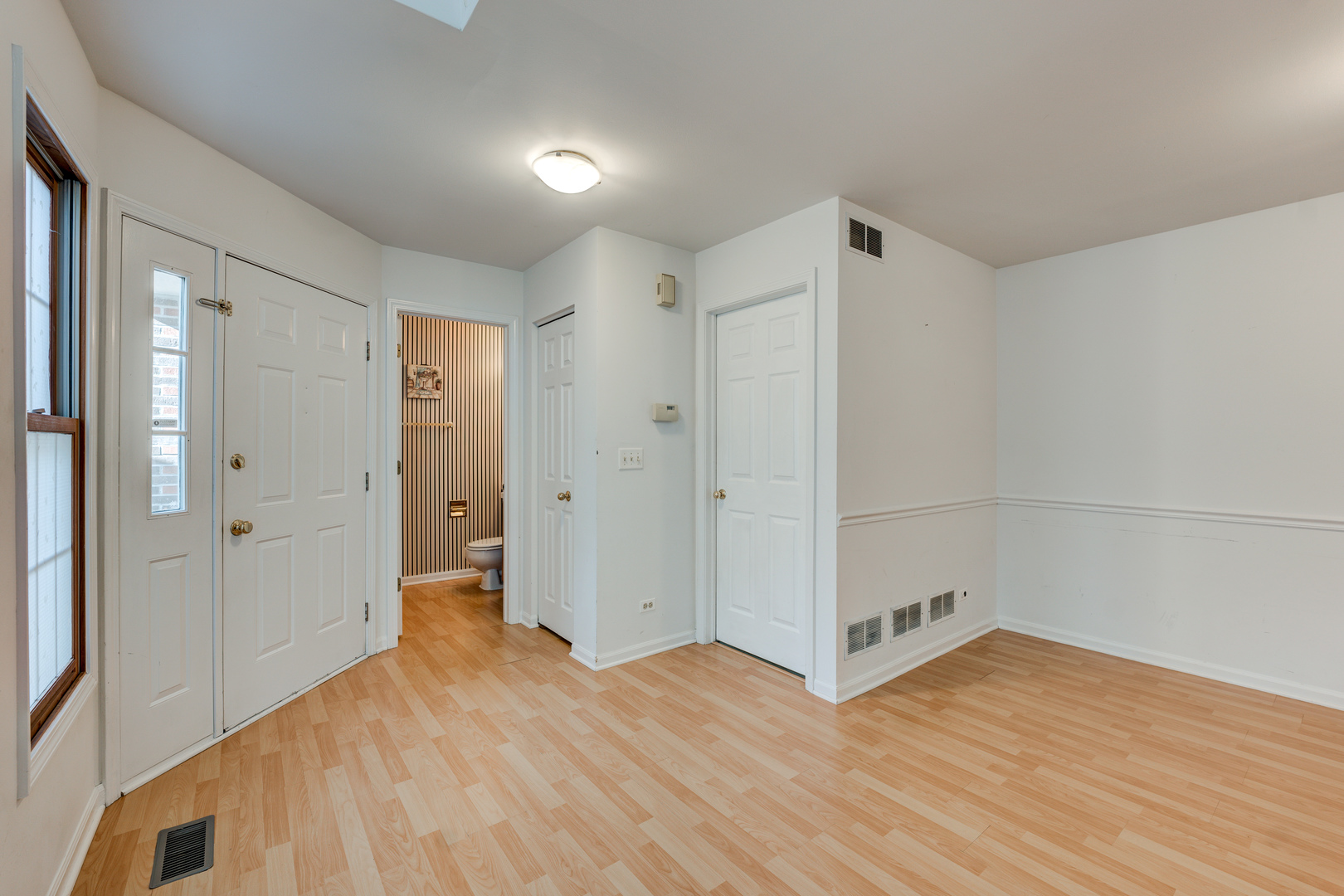 298 Ripplebrook Court Schaumburg, IL 60173 - Photo 4 of 27 a view of a hallway with wooden floor