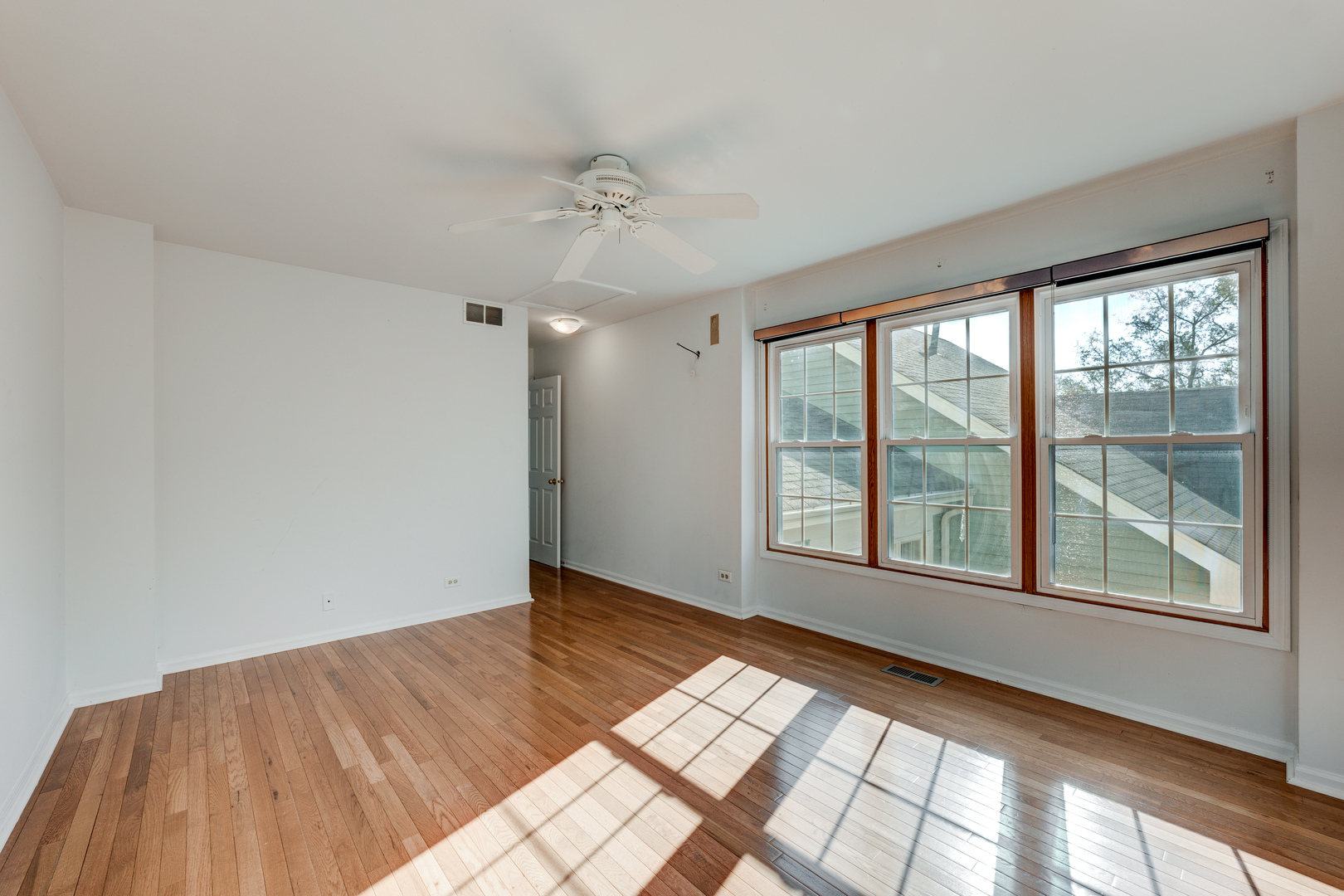 298 Ripplebrook Court Schaumburg, IL 60173 - Photo 7 of 27 a view of an empty room with a window