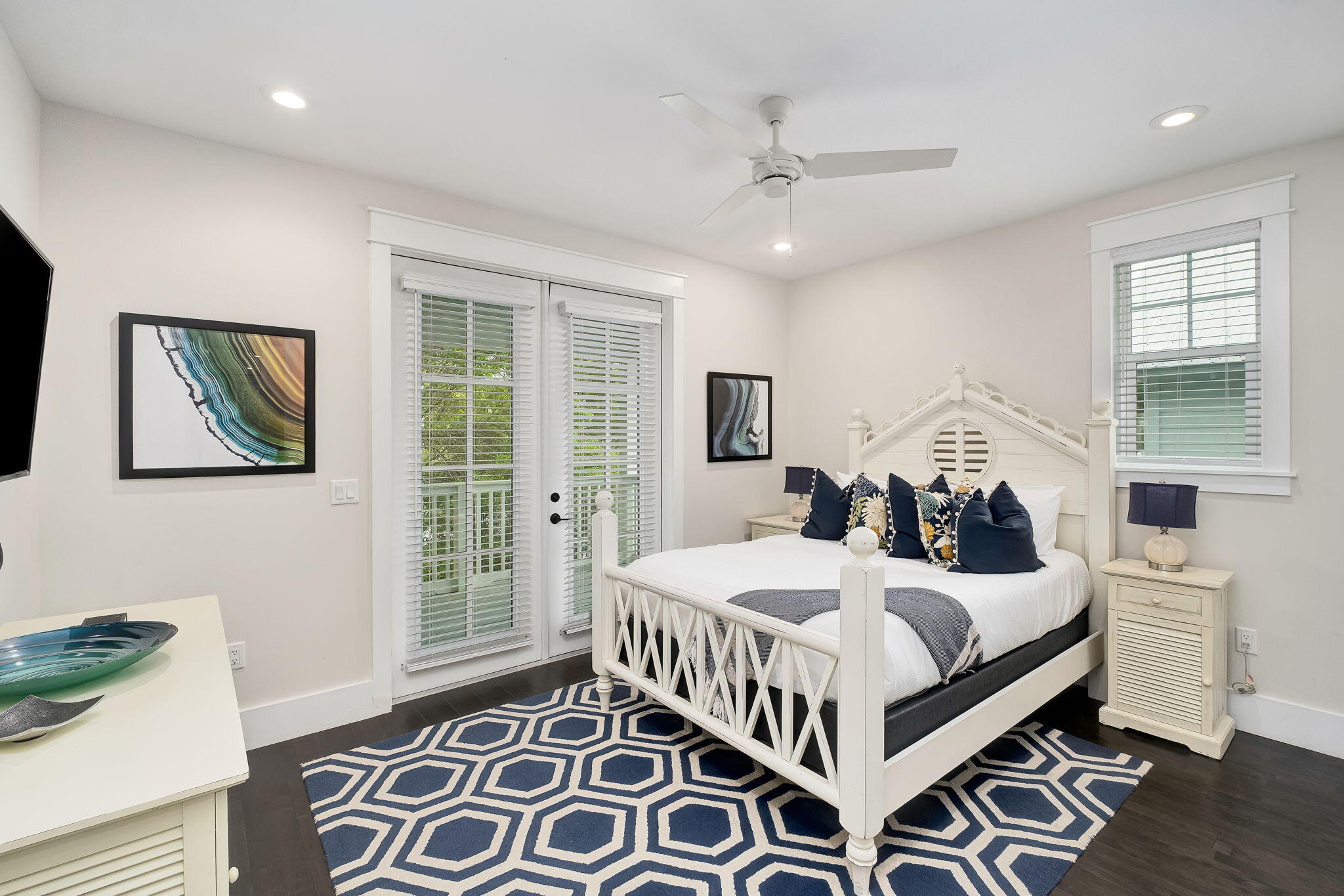 2846 South County Highway 395 Santa Rosa Beach, FL 32459 - Photo 15 of 19 a bedroom with a bed a mirror and a window
