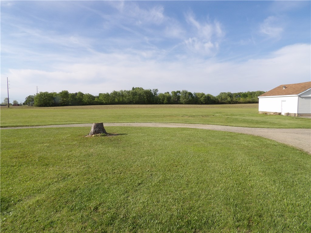 4505 North Alcony Conover Road Conover, OH 45317 - Photo 48 of 64 Expansive green yard with a utility building offers endless possibilities.