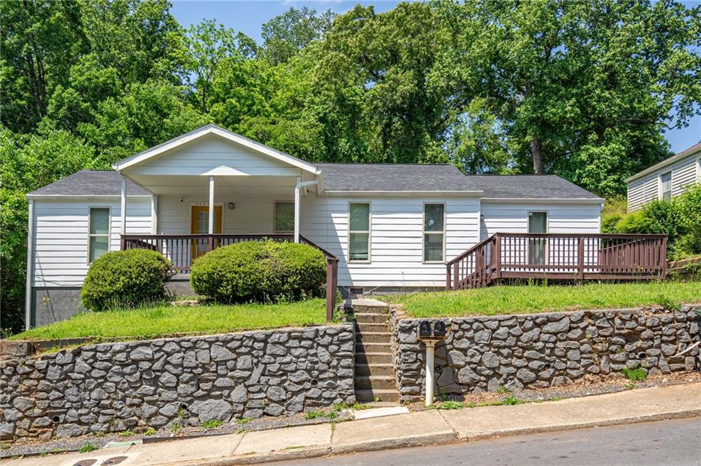 3277 Wheeler Street Hapeville, GA 30354 - Photo 1 of 1 a front view of a house with a yard