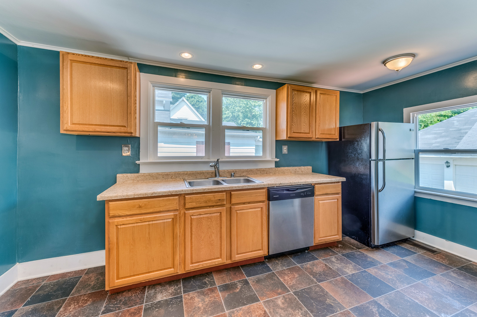209 West Exchange Street Sycamore, IL 60178 - Photo 14 of 25 a kitchen with stainless steel appliances granite countertop a refrigerator sink and cabinets