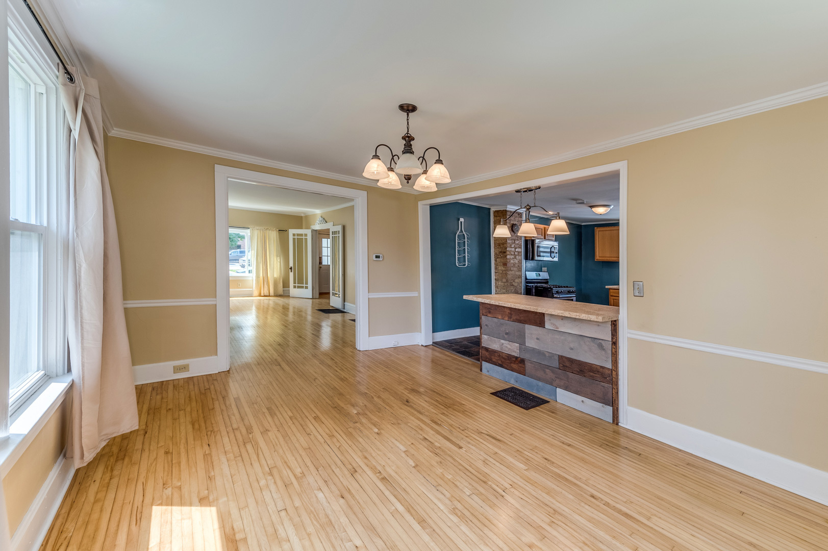 209 West Exchange Street Sycamore, IL 60178 - Photo 16 of 25 wooden floor in an empty room with a mirror