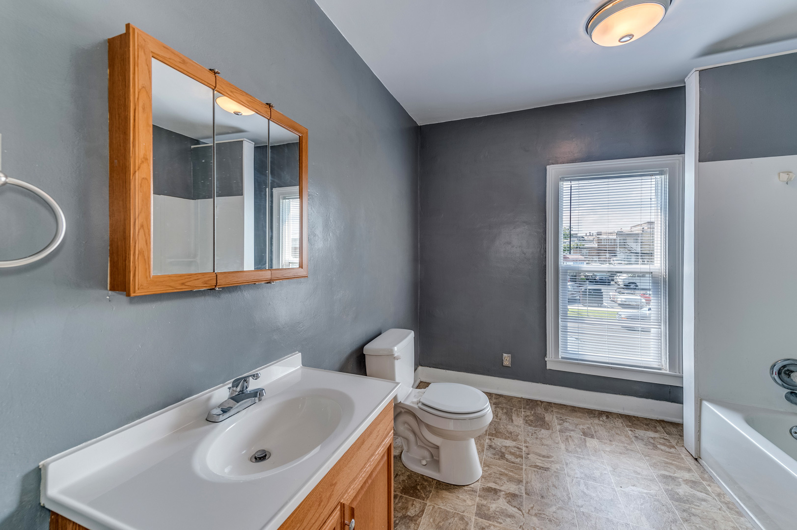 209 West Exchange Street Sycamore, IL 60178 - Photo 20 of 25 a bathroom with a sink mirror and toilet