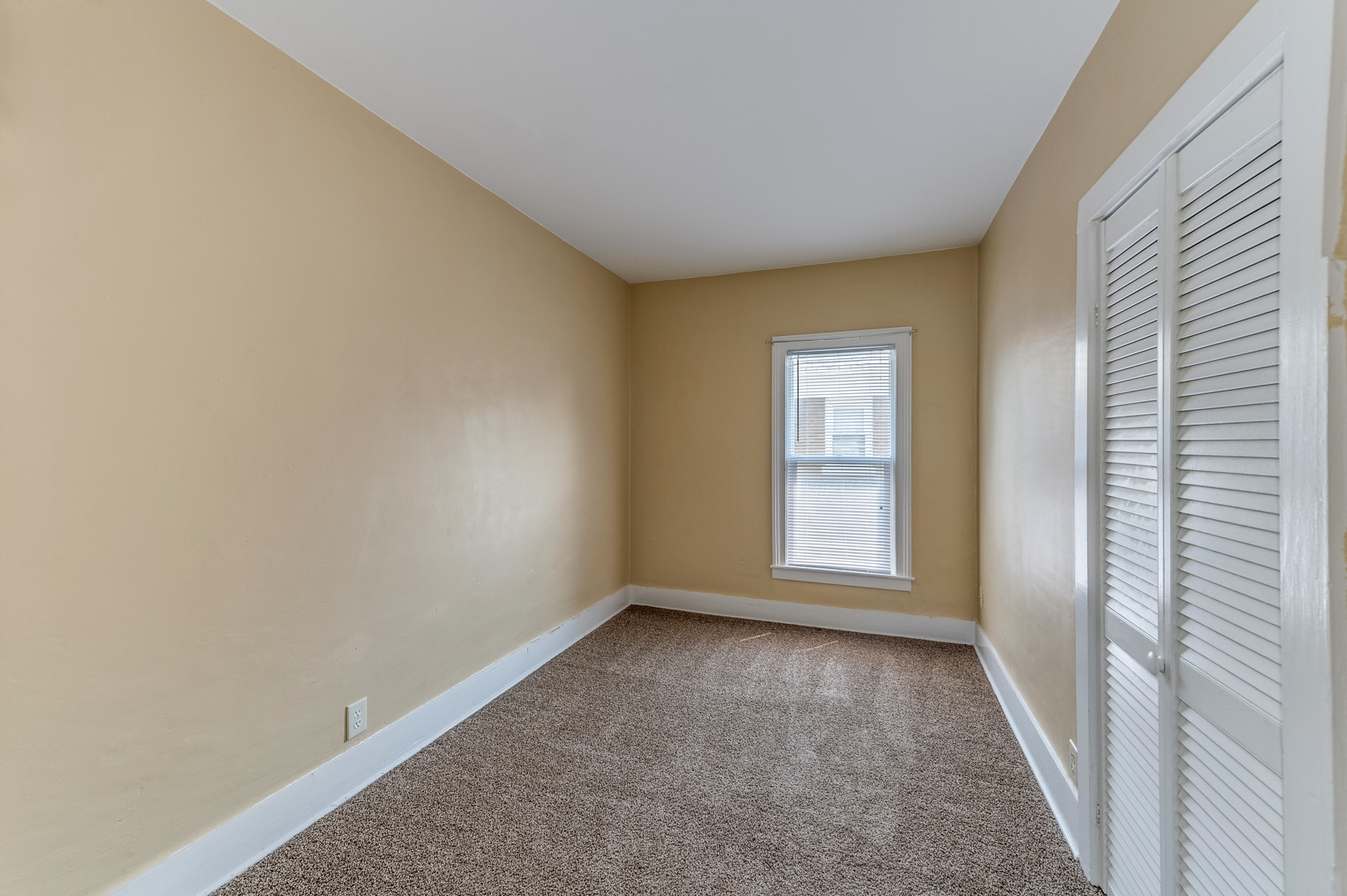 209 West Exchange Street Sycamore, IL 60178 - Photo 21 of 25 a view of an empty room with a window