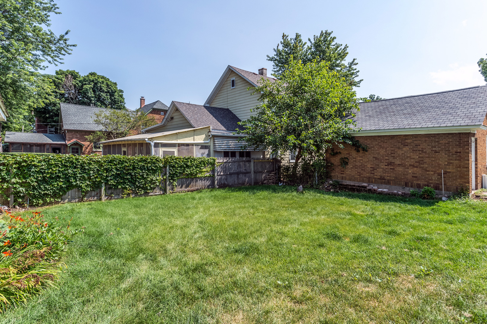 209 West Exchange Street Sycamore, IL 60178 - Photo 24 of 25 a front view of a house with a yard