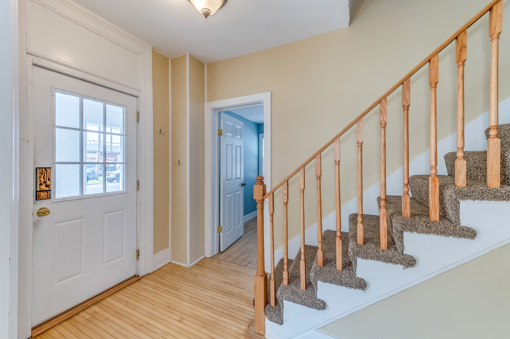 209 West Exchange Street Sycamore, IL 60178 - Photo 4 of 25 a view of staircase with white walls and windows