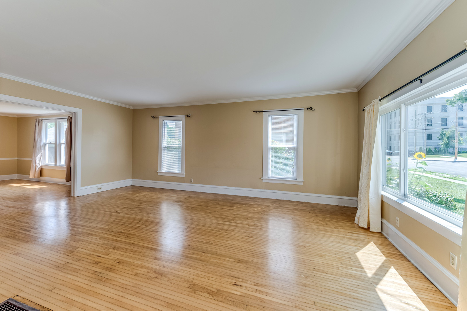 209 West Exchange Street Sycamore, IL 60178 - Photo 5 of 25 a view of empty room with wooden floor and fan