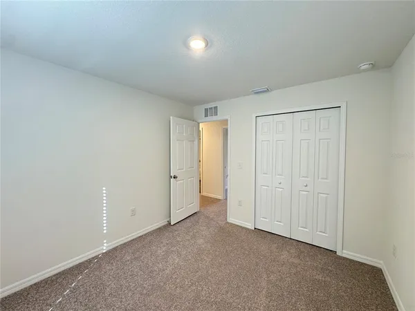 a view of a livingroom with furniture and a window