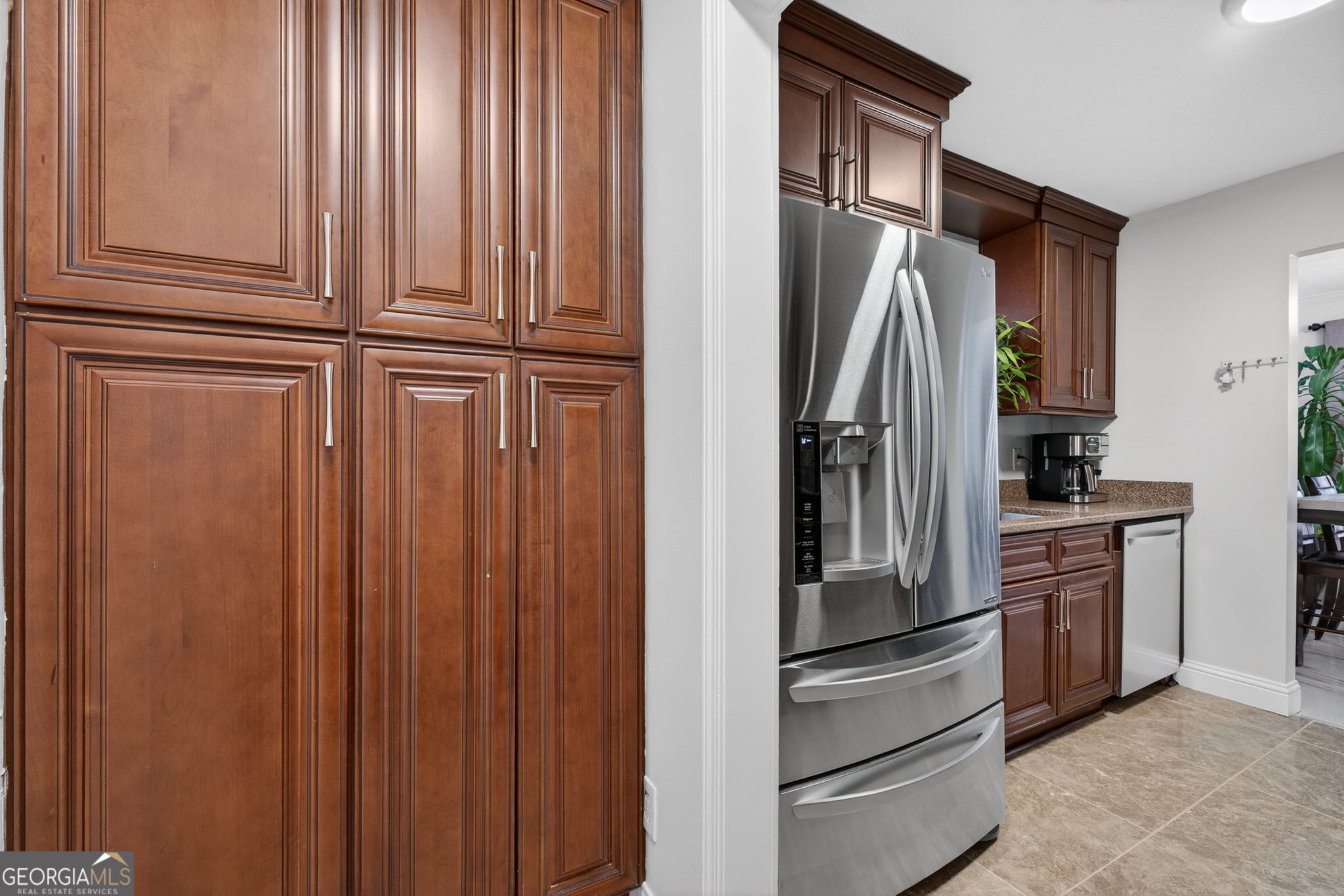 1589 Bonanza Church Road Hampton, GA 30228 - Photo 12 of 28 a metallic refrigerator freezer and a stove sitting inside of a kitchen