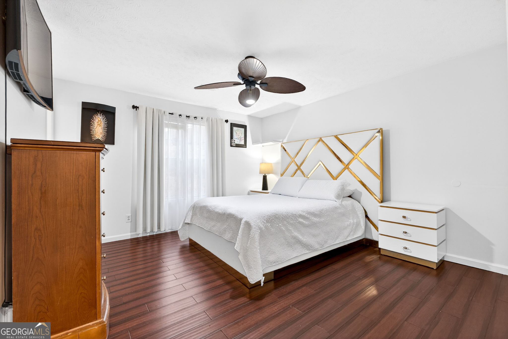 1589 Bonanza Church Road Hampton, GA 30228 - Photo 13 of 28 a bedroom with a bed and wooden floor