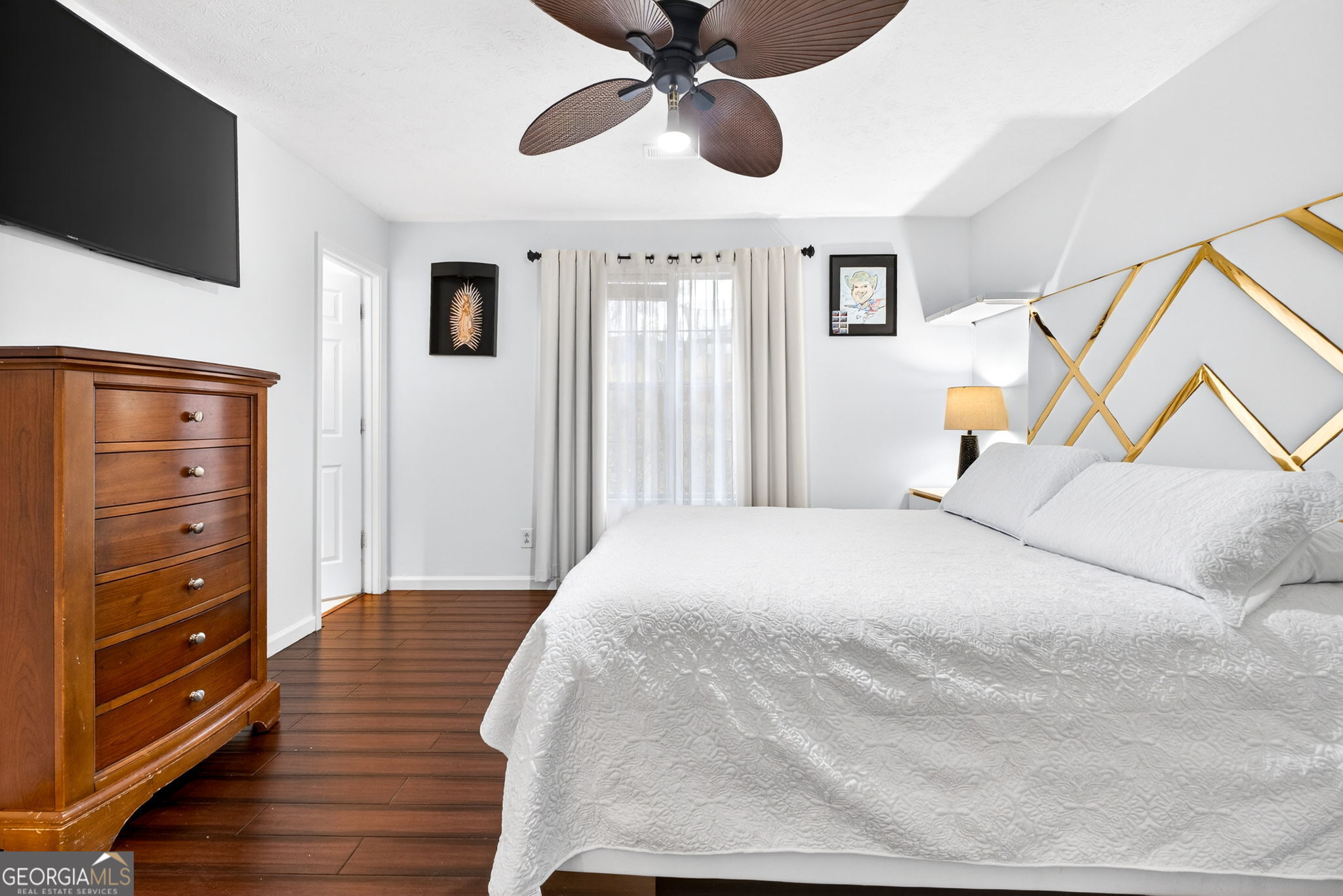 1589 Bonanza Church Road Hampton, GA 30228 - Photo 14 of 28 a bedroom with a bed and wooden floor