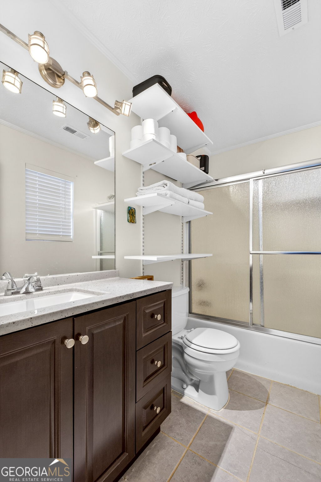 1589 Bonanza Church Road Hampton, GA 30228 - Photo 16 of 28 a bathroom with a sink a toilet and a mirror